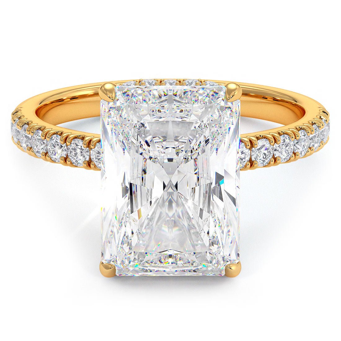 This exquisite radiant-cut lab-grown diamond is showcased in a classic solitaire setting, complemented by a subtle hidden halo and a delicate petite micropavé band. Designed for modern elegance, this piece offers a refined and timeless silhouette that captures light from every angle.